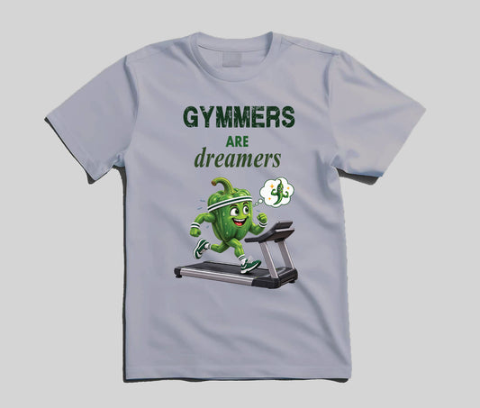 A light gray crew neck t-shirt featuring a graphic print of a green cartoon capsicum character running on a treadmill with the text 'GYMMERS ARE dreamers' in dark green and white.