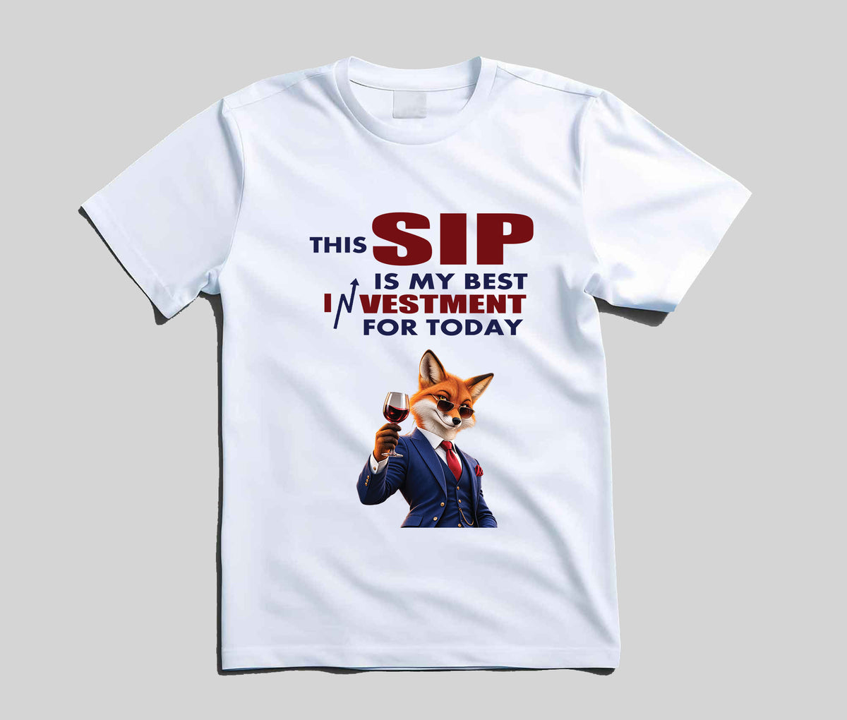 A white short-sleeve crew neck t-shirt with a graphic print. The print features the text 'THIS SIP IS MY BEST INVESTMENT FOR TODAY' in red and blue lettering, accompanied by a cartoon illustration of a fox in a business suit holding a glass of red wine.