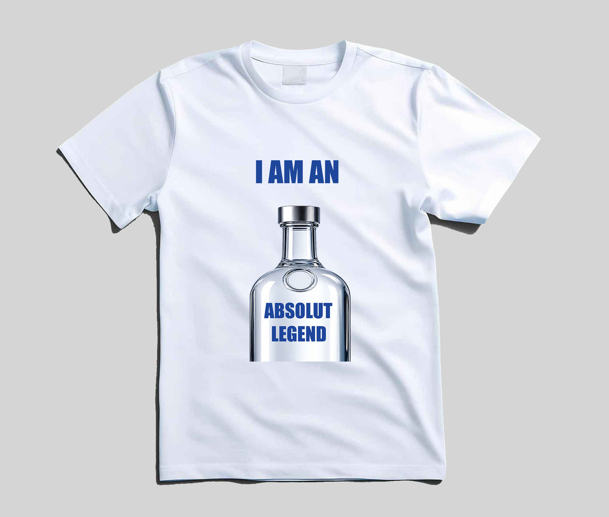 A white short-sleeve t-shirt with a graphic of a clear Absolut vodka bottle and blue text reading 'I AM AN ABSOLUT LEGEND' on a light gray background.