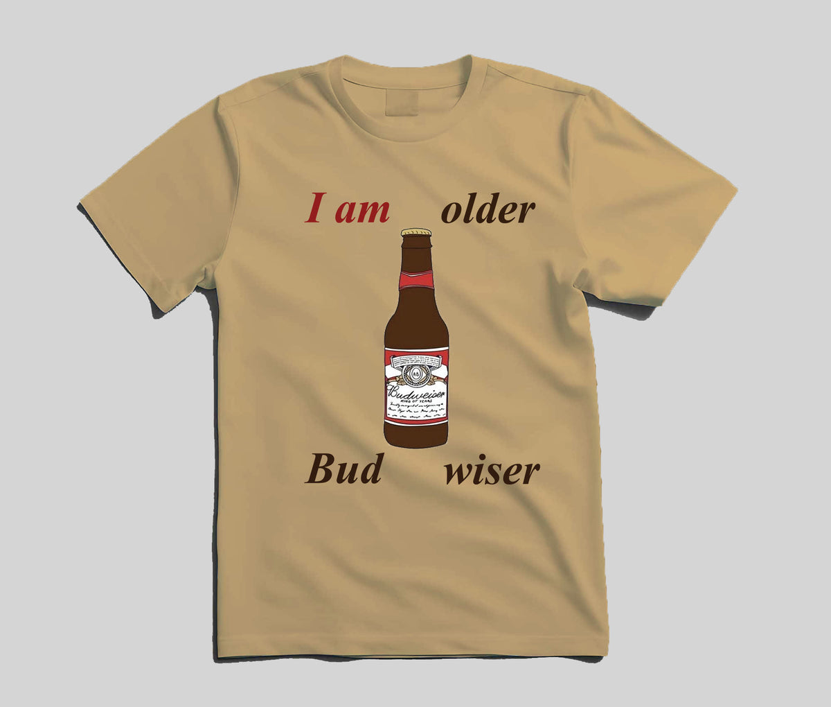 A beige short-sleeve t-shirt with a graphic print of a Budweiser bottle and the text 'I am older Bud wiser' in red and black, displayed on a neutral gray background.