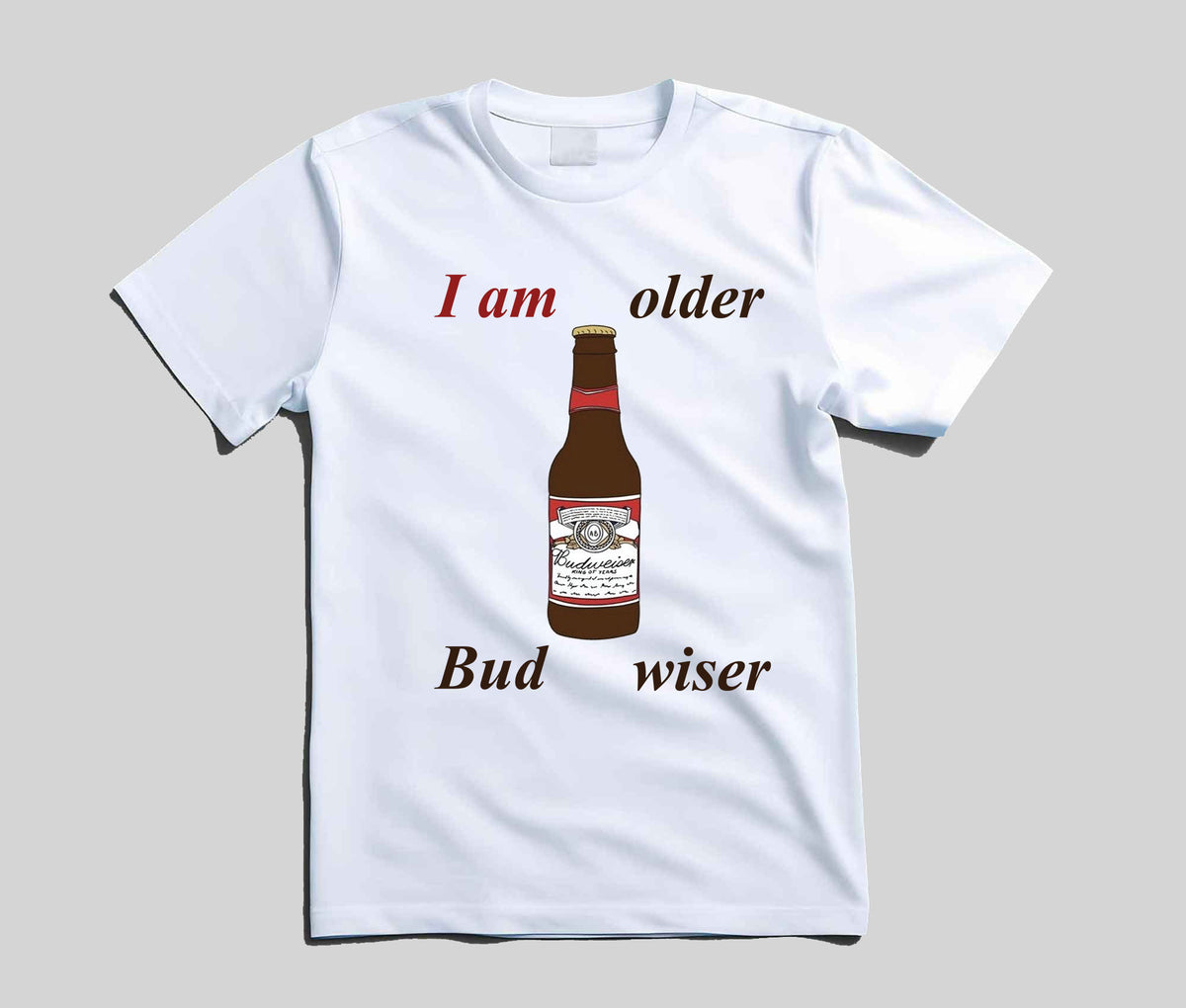A white short-sleeve t-shirt with a graphic print of a Budweiser bottle and the text 'I am older Bud wiser' on a solid gray background.