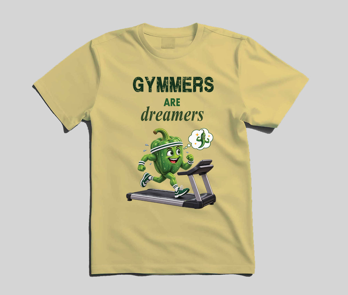 A light yellow crew neck t-shirt featuring a graphic print of a green cartoon capsicum character running on a treadmill with the text 'GYMMERS ARE dreamers' in dark green and white.